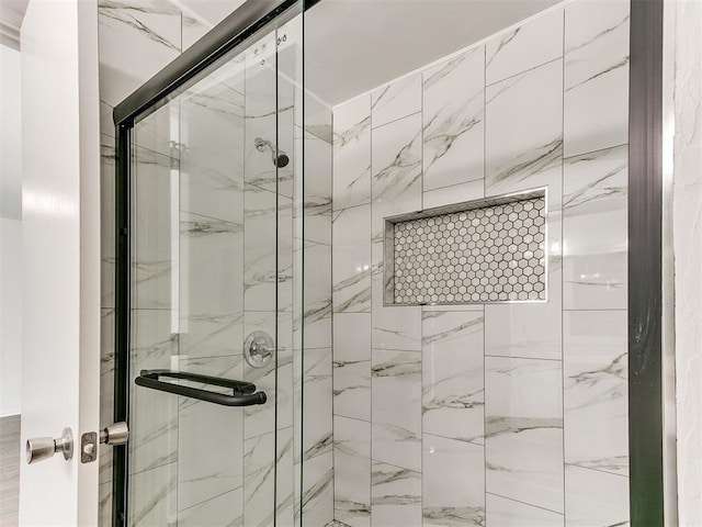 full bath featuring a shower stall