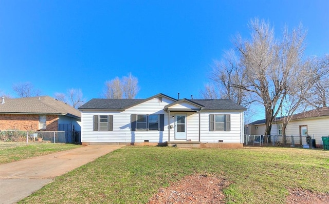 view of front of house with crawl space, driveway, a front yard, and fence