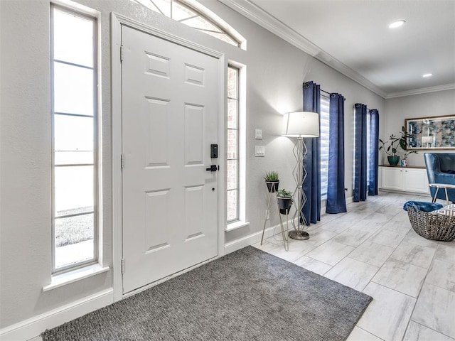 entryway featuring recessed lighting, crown molding, and baseboards