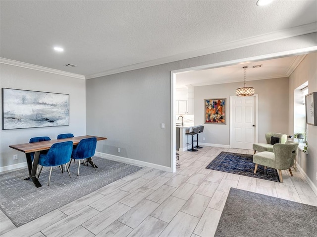 dining area featuring a textured ceiling, baseboards, and crown molding