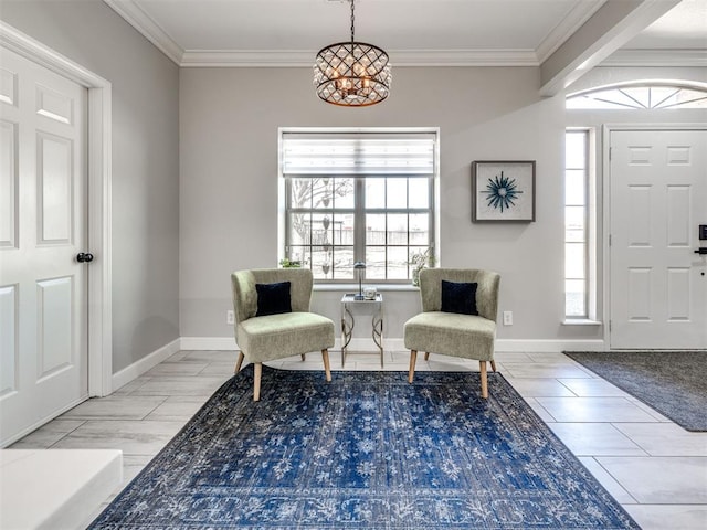 foyer entrance with ornamental molding and baseboards