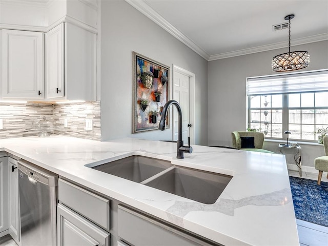 kitchen featuring white cabinets, dishwasher, light stone counters, ornamental molding, and a sink