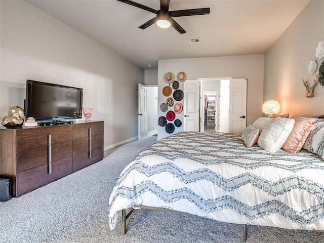 bedroom with a ceiling fan, carpet, visible vents, and baseboards