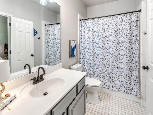 full bath featuring curtained shower, vanity, and toilet