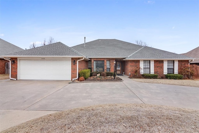 ranch-style house featuring a shingled roof, concrete driveway, brick siding, and a garage