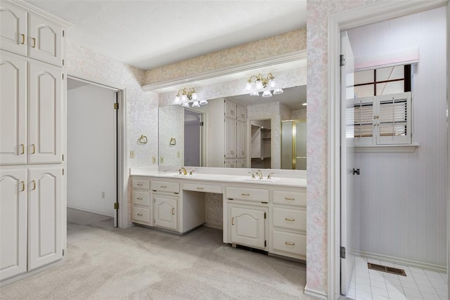 bathroom with wallpapered walls, visible vents, and vanity