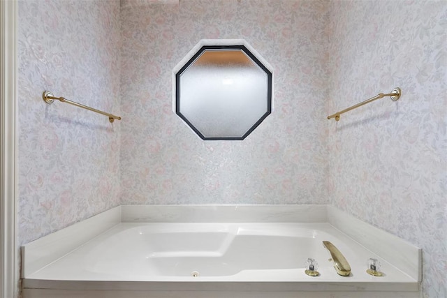 full bathroom featuring wallpapered walls and a bath