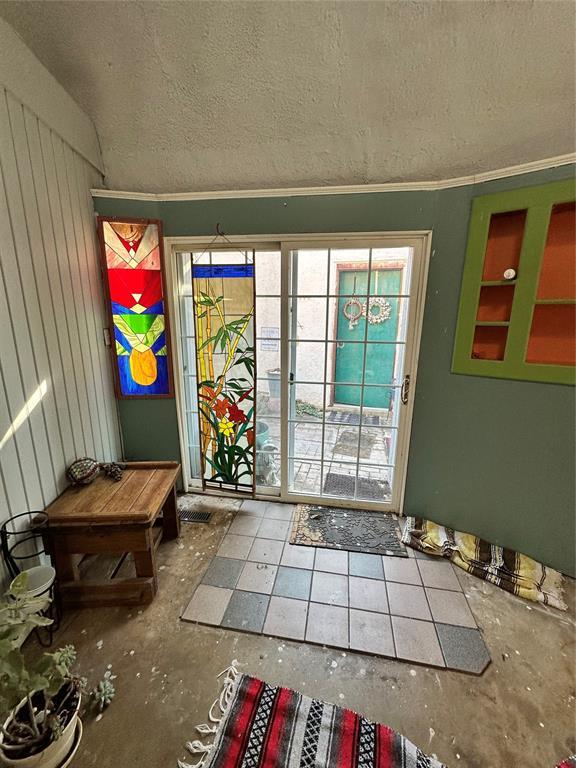 entryway with a textured ceiling