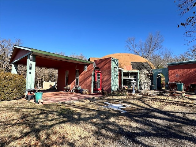 back of property with a patio area