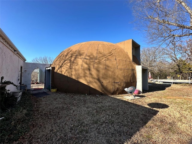 view of side of property featuring stucco siding