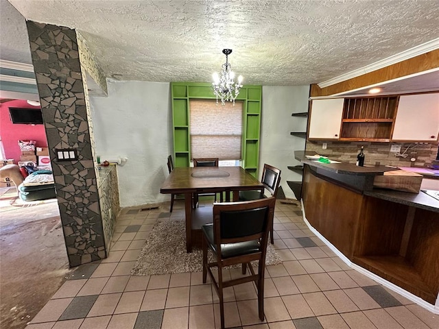 dining area featuring light tile patterned flooring, a textured ceiling, and an inviting chandelier