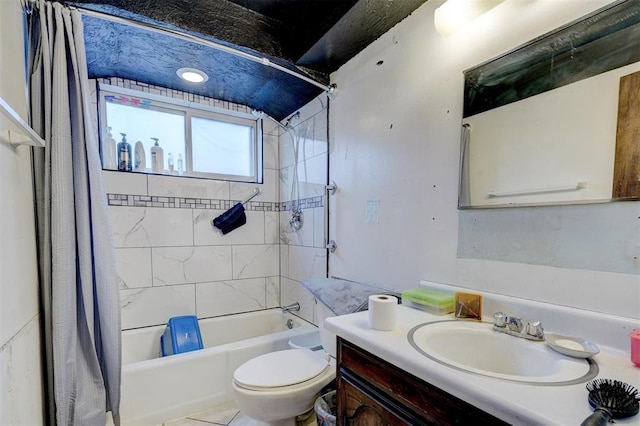 bathroom with shower / bathtub combination with curtain, toilet, and vanity