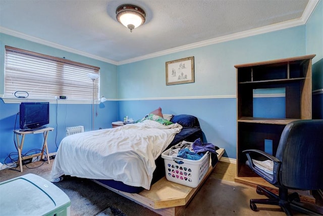 bedroom featuring carpet floors, ornamental molding, a textured ceiling, and baseboards