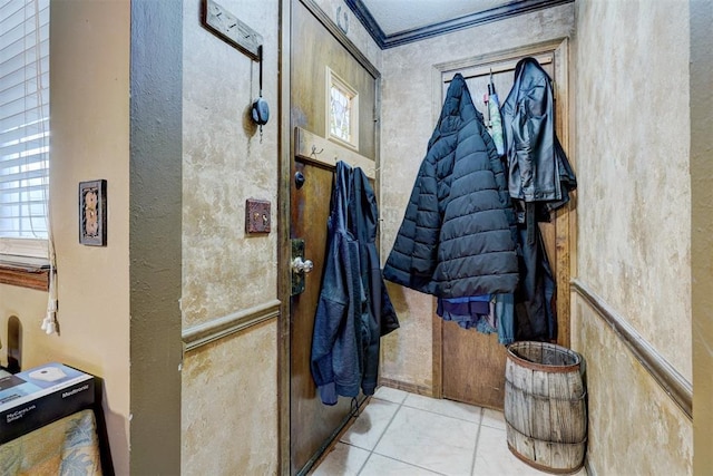 bathroom featuring tile patterned flooring and crown molding