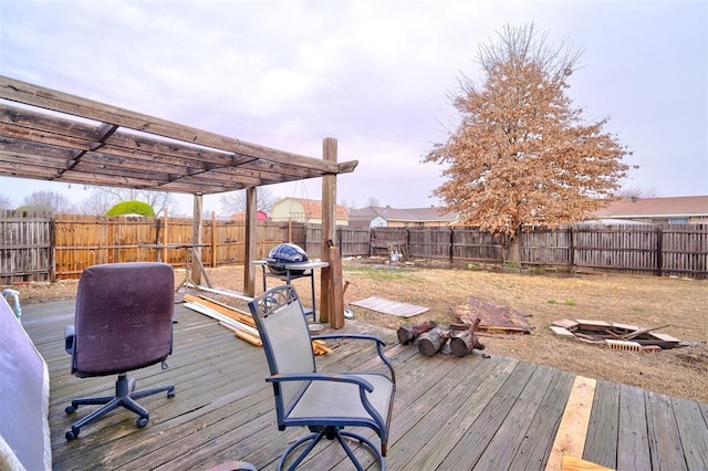 wooden deck featuring a fenced backyard and a pergola