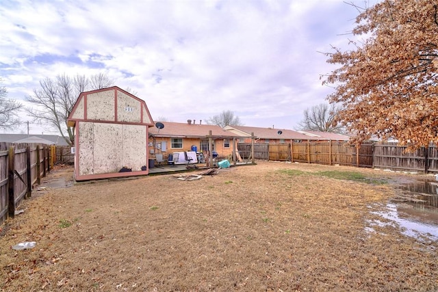 back of house featuring a fenced backyard