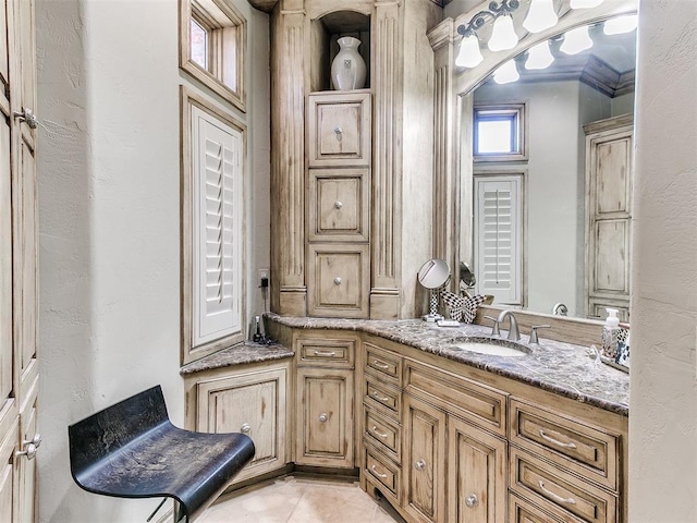 bathroom featuring tile patterned flooring and vanity