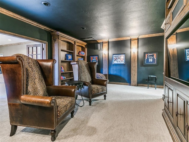 living area with carpet floors, crown molding, decorative columns, a textured ceiling, and baseboards