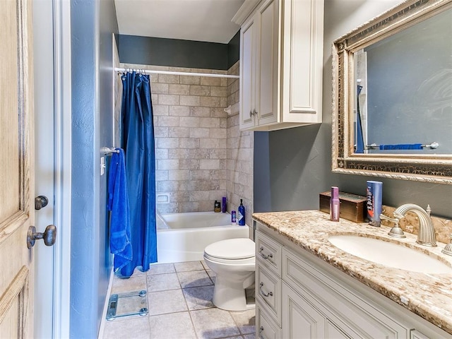 bathroom featuring vanity, tile patterned flooring, shower / bath combo with shower curtain, and toilet