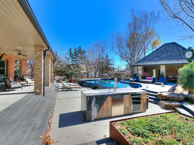 pool featuring a ceiling fan and a patio