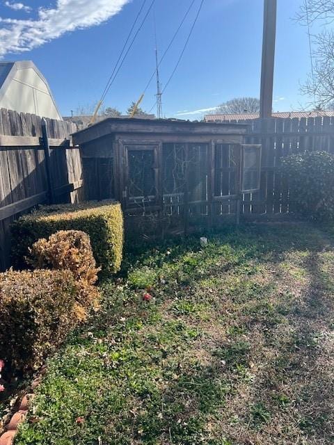 back of property with fence