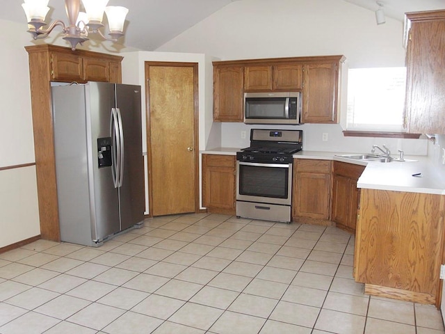 kitchen with appliances with stainless steel finishes, brown cabinetry, and light countertops