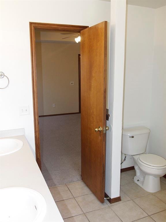 bathroom featuring double vanity, tile patterned flooring, and a sink