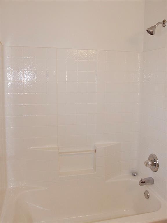 full bath featuring  shower combination