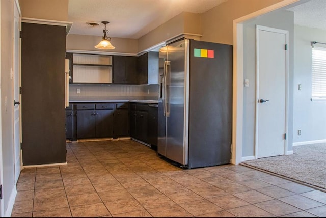 kitchen featuring light carpet, visible vents, pendant lighting, stainless steel refrigerator with ice dispenser, and backsplash