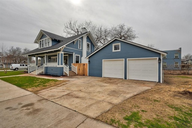 view of front of house featuring driveway and a porch