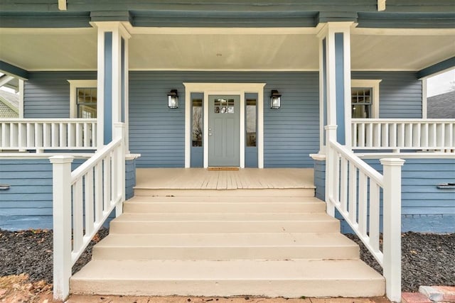 entrance to property featuring a porch