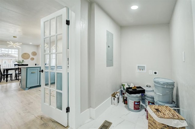 laundry area with hookup for a washing machine, laundry area, electric panel, light wood finished floors, and electric dryer hookup