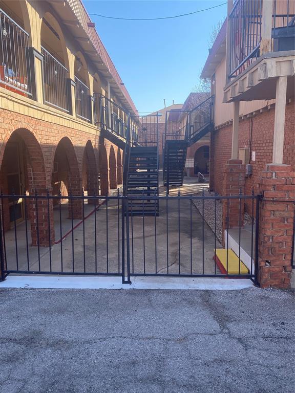 view of gate featuring stairway