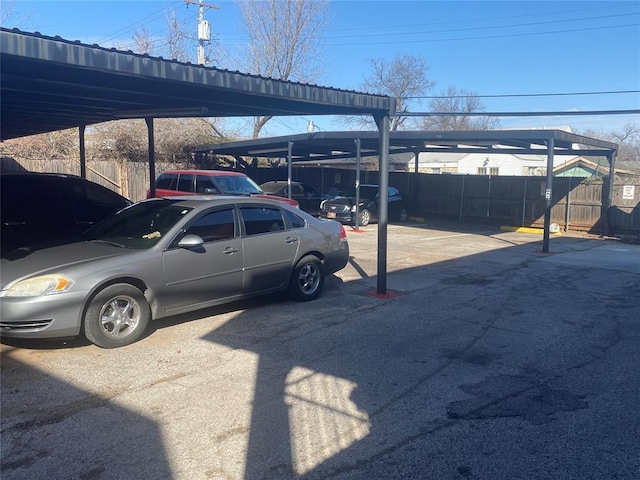 covered parking lot with fence