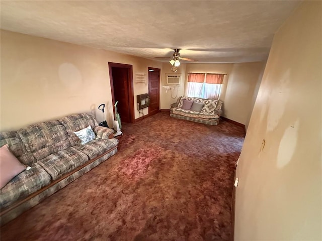 carpeted living room featuring a ceiling fan, heating unit, baseboards, and a wall mounted AC