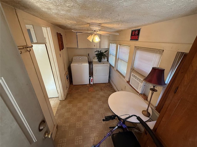 laundry room with a textured ceiling, ceiling fan, cooling unit, washer and dryer, and tile patterned floors