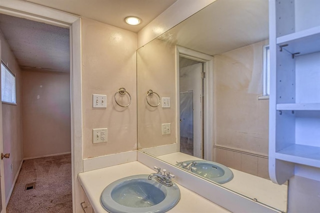 bathroom with visible vents and vanity