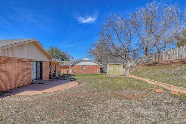 view of yard with a patio and fence