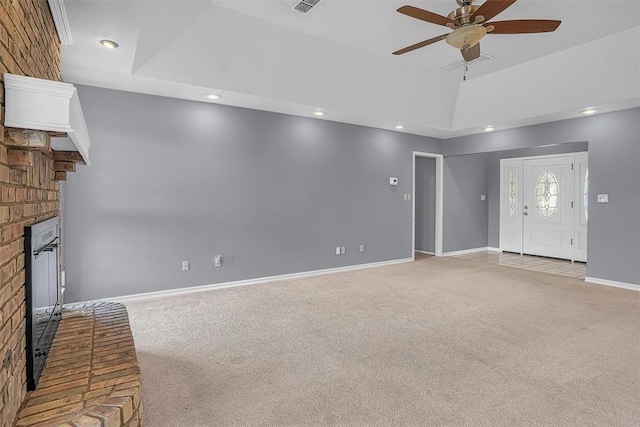 unfurnished living room with baseboards, a fireplace, lofted ceiling, and light colored carpet