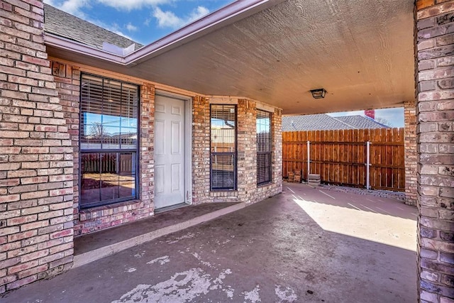 view of patio / terrace featuring fence