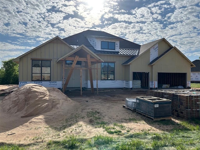10008 Calypso Way, Yukon, OK 73099 - view of front of house featuring a garage and board and batten siding