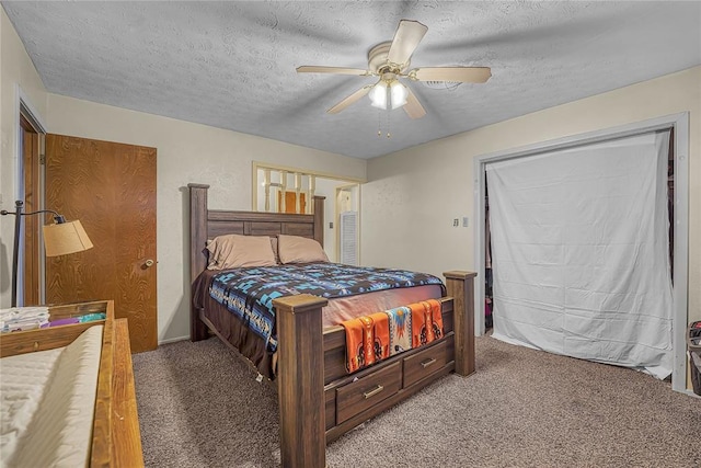 carpeted bedroom with a textured ceiling and ceiling fan