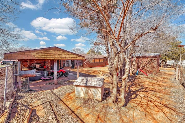 view of yard with an outdoor structure and fence