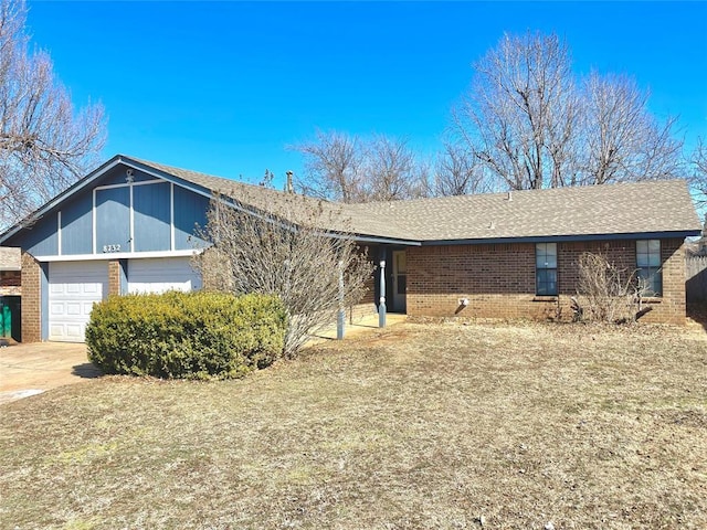 view of front of property with a garage, brick siding, a shingled roof, and driveway