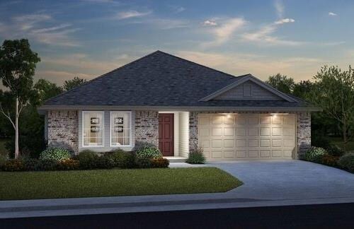 ranch-style house featuring driveway, an attached garage, and a front yard