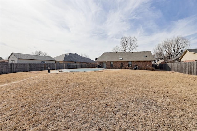 view of yard with a fenced backyard