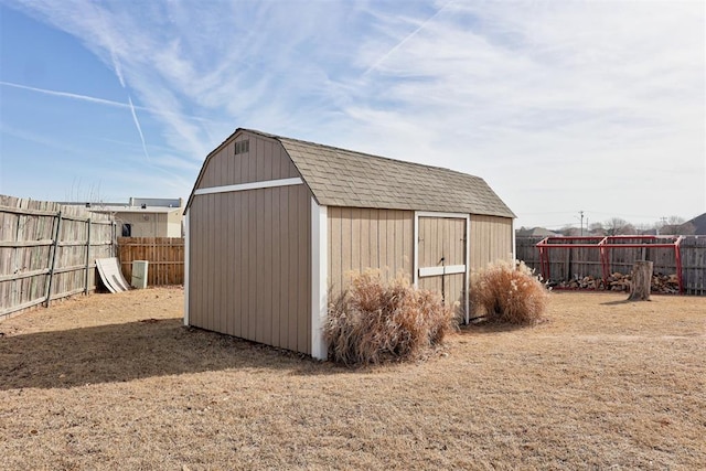 view of shed with a fenced backyard