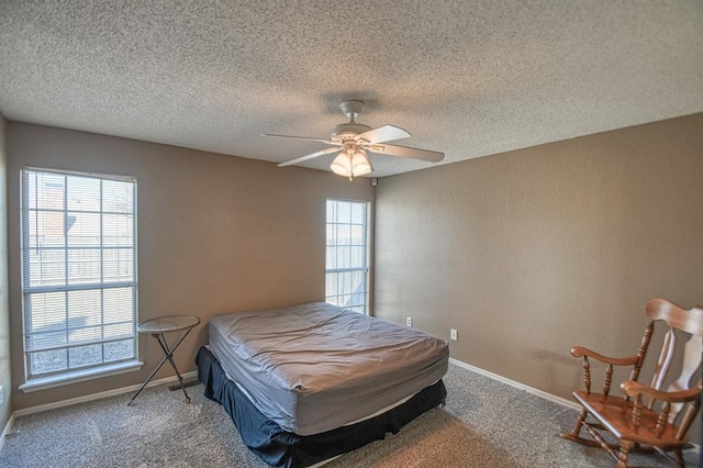 bedroom with multiple windows, carpet flooring, and baseboards