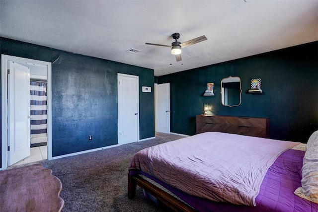 bedroom featuring carpet floors, visible vents, and a ceiling fan