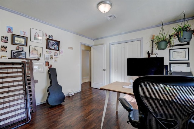 office area with baseboards, visible vents, crown molding, and wood finished floors